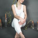 Portrait photo of a smiling woman, a yoga practitioner.